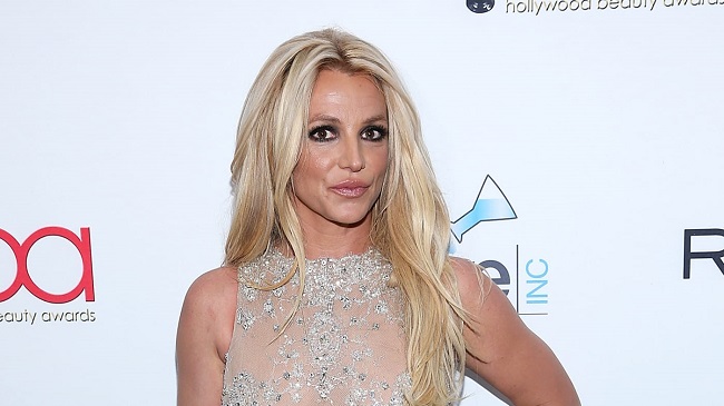 Britney Spears Rolled Around Topless on The Beach